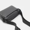 Bolso bandolera de tela recubierta de goma