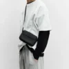 Bolso bandolera de tela recubierta de goma