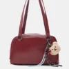 Bolso de hombro con adornos