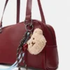 Bolso de hombro con adornos