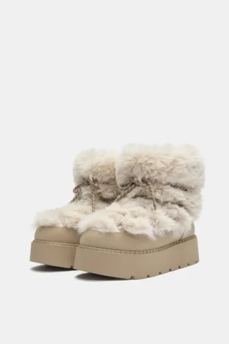 Botas planas de pelo sintético