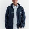 Chaqueta con cremallera bordada