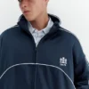Chaqueta con cremallera bordada