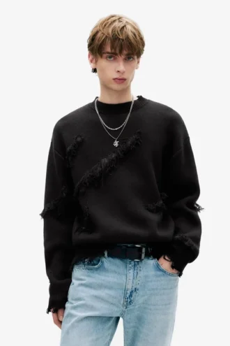 Jersey con flecos y rasgaduras