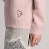 Jerséu rosa con corazón bordado Jerséu rosa con corazón bordado