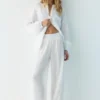Pantalones fluidos con efecto gasa Pantalones fluidos con efecto gasa