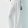 Pantalones fluidos con efecto gasa Pantalones fluidos con efecto gasa