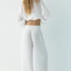 Pantalones fluidos con efecto gasa Pantalones fluidos con efecto gasa