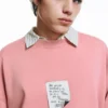 Sudadera rosa con etiqueta Sudadera rosa con etiqueta