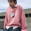 Sudadera rosa con etiqueta Sudadera rosa con etiqueta