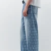 Vaqueros de pierna ancha con estampado de estrellas Vaqueros de pierna ancha con estampado de estrellas
